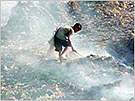 A child scavenging for valuable materials at the final disposal site in Cambodia