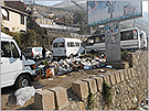 Illegally dumped waste on the road shoulder